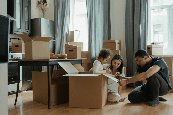 Family unpacking in new home
