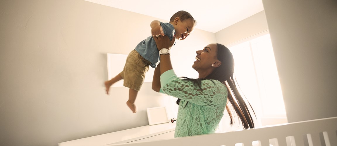 Mother and son playing in new home