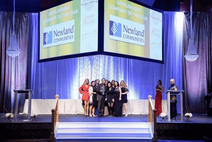 Staff of Newland accepting Developer of the Year award