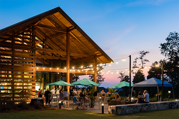 Farmhouse Cafe and outdoor seating patio area at dusk