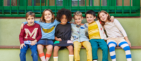Elementary school kids sitting together