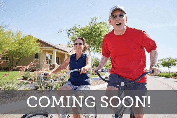 Couple riding bicycles in Wendell Falls