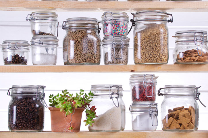 neatly arranged jars on kitchen shelving