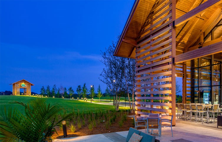 Twilight image of the Farmhouse and Tobacco Barn at Wendell Falls.